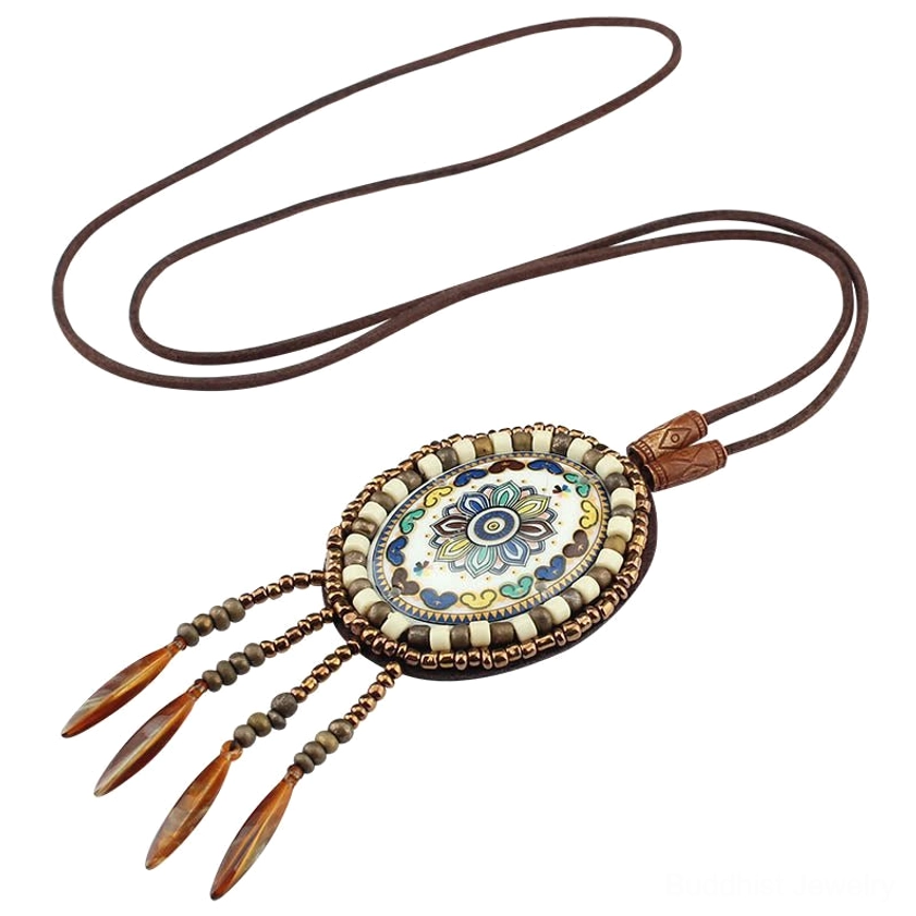 Pastel mandala mosaic pendant necklace with brown tassel charms and brown leather strap on plain background