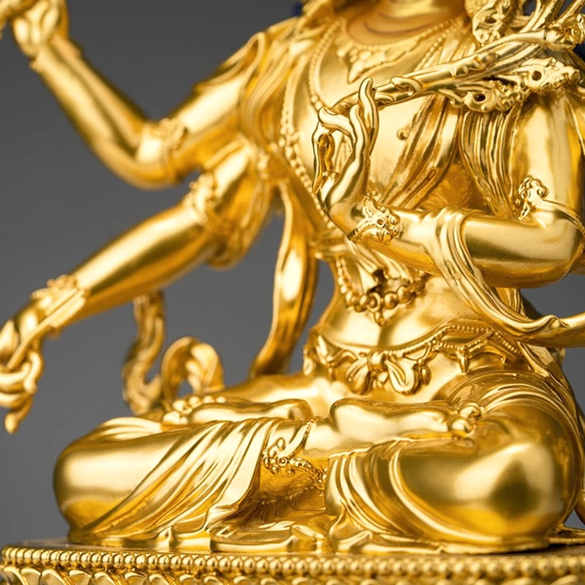 Four-armed Manjusri seated figure gold copper statue torso and jewelry detail