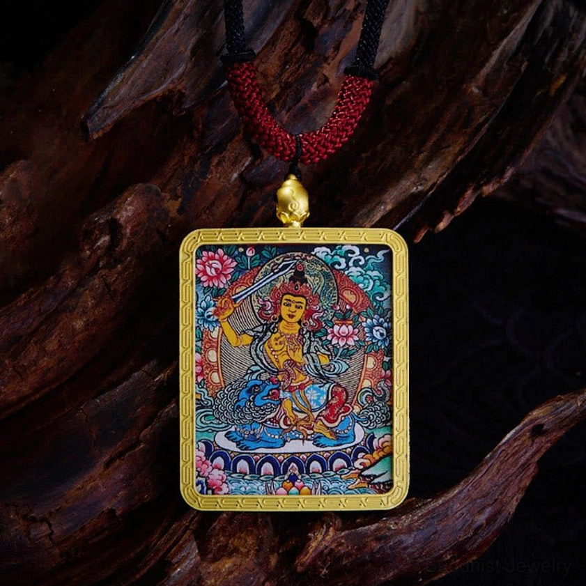 Manjusri Buddhist Thangka pendant featuring wisdom deity with gold frame and floral Buddhist motifs