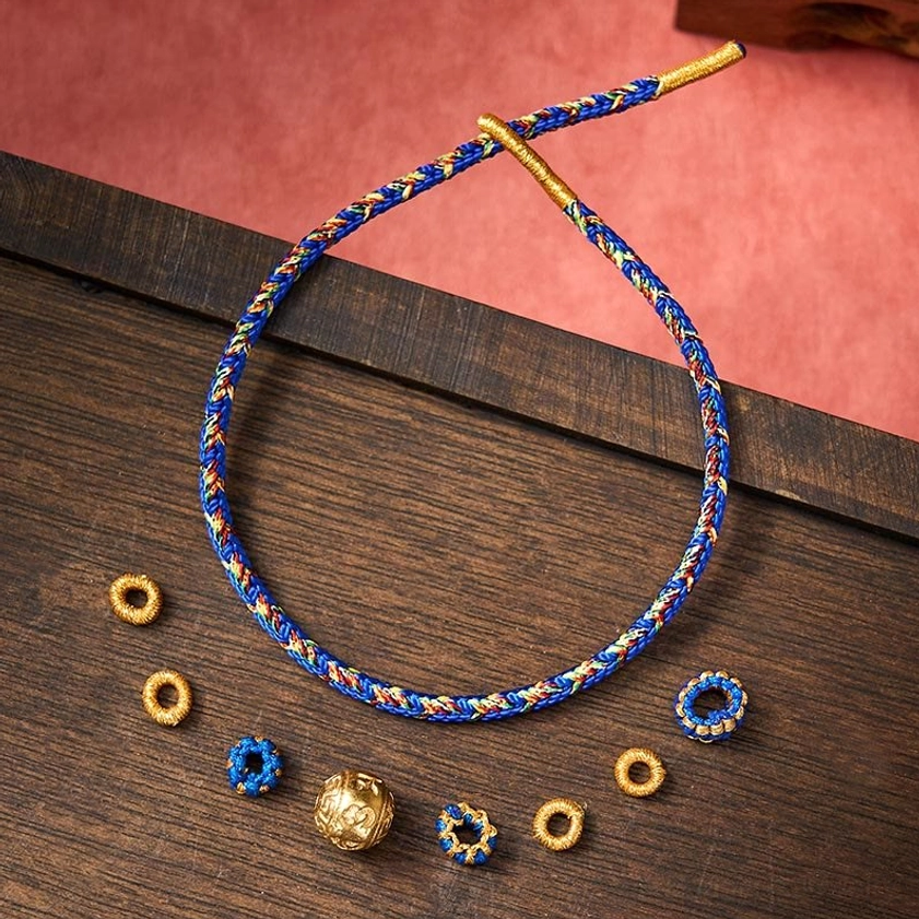 Om Mani Padme Hum bracelet displayed with matching metal charm beads and spiritual accessories