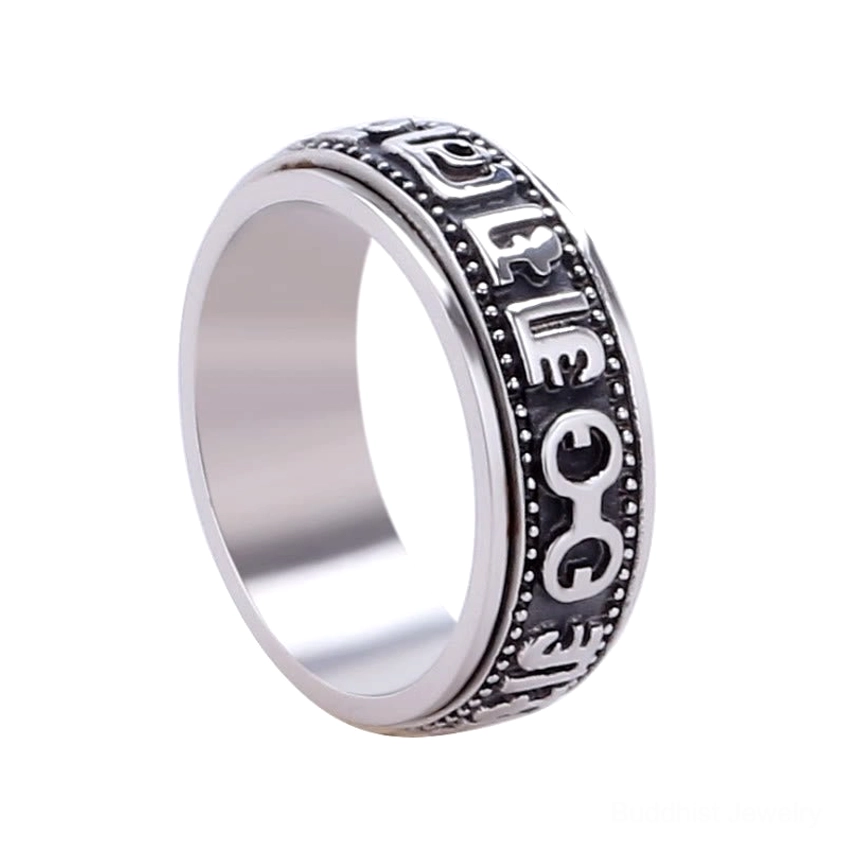 Buddhist meditation spinner ring detailed close-up of engraved Sanskrit mantra on band