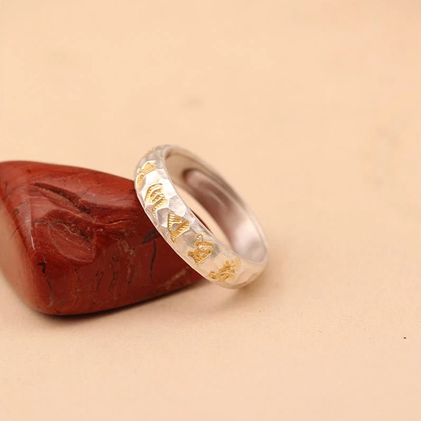 Mantra ring with patina showing natural aging and personal energy journey reflection over time