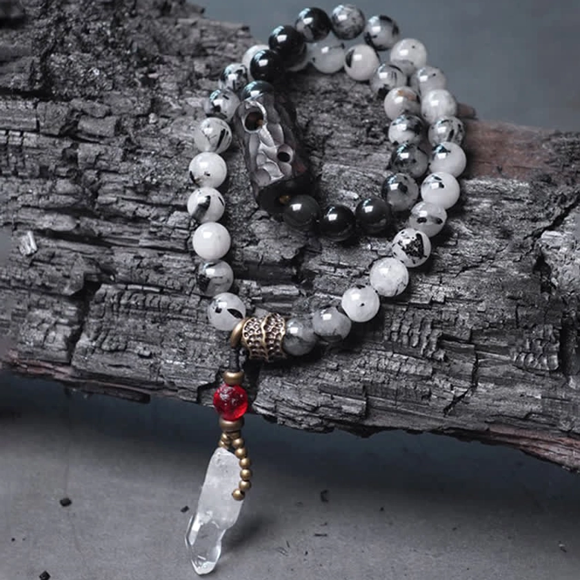 Matching pair of success bracelets with rutilated quartz beads and red accent stone