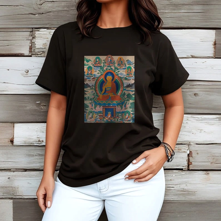 Female model wearing black Medicine Buddha spiritual t-shirt paired with white jeans casual styling