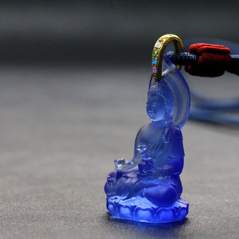 Dark blue Medicine Buddha pendant deep indigo translucent Liuli crystal with gold bail and red lanyard