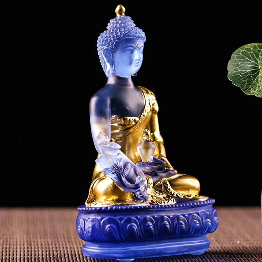 Medicine Buddha Liuli glass statue detail shot showing intricate hand-carved robe patterns, gilding, and craftsmanship quality