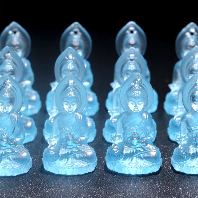 Handcrafted Medicine Buddha Liuli pendant showing artisanal quality and natural color variation characteristics