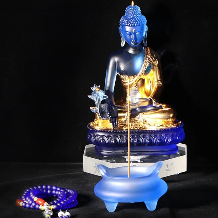 Medicine Buddha handmade Liuli crystal sculpture positioned in home altar or meditation space with spiritual decor setup