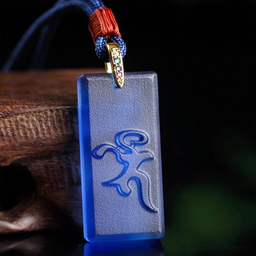 Medicine Buddha Liuli crystal pendant necklace with blue glass and Sanskrit mantra carving