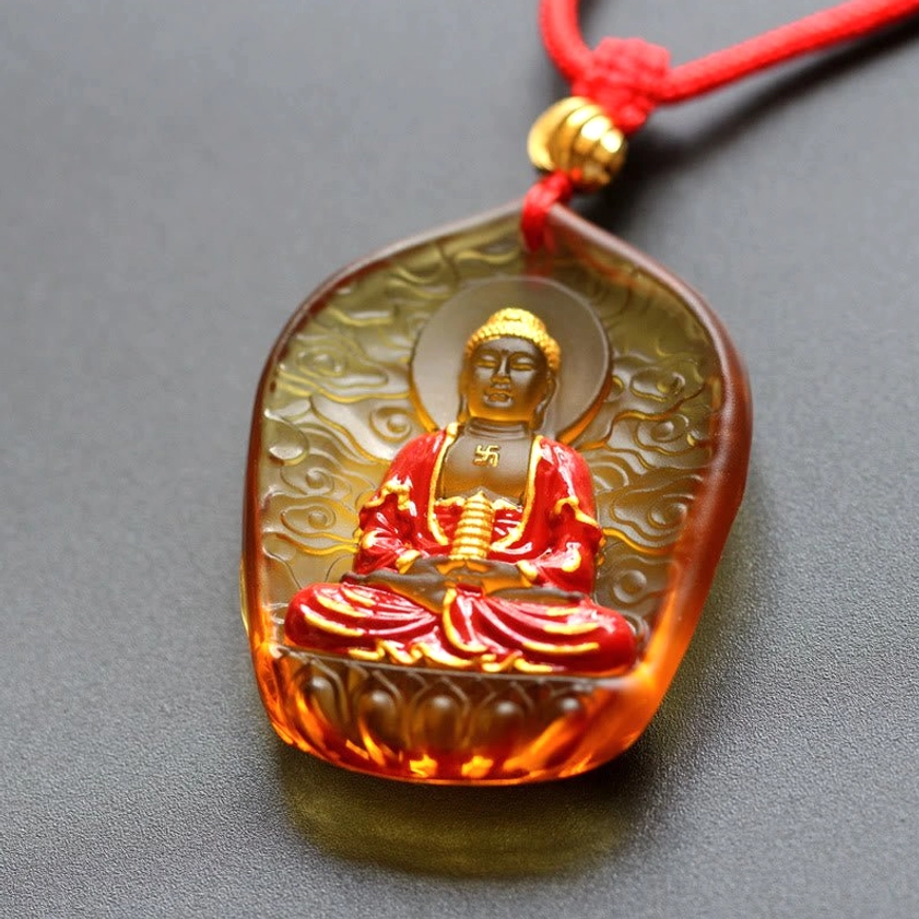 Auspicious Clouds Medicine Buddha Liuli pendant with embossed celestial patterns and purple-blue glass finish