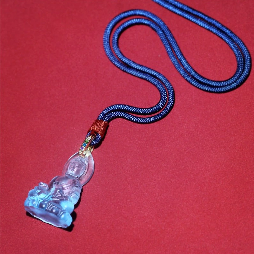 Complete Medicine Buddha necklace full length with dark blue woven cord and seated Buddha pendant
