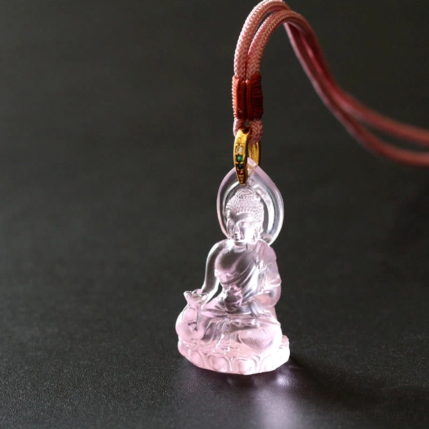 Medicine Buddha pendant necklace lifestyle styling with blue cord and healing energy appearance