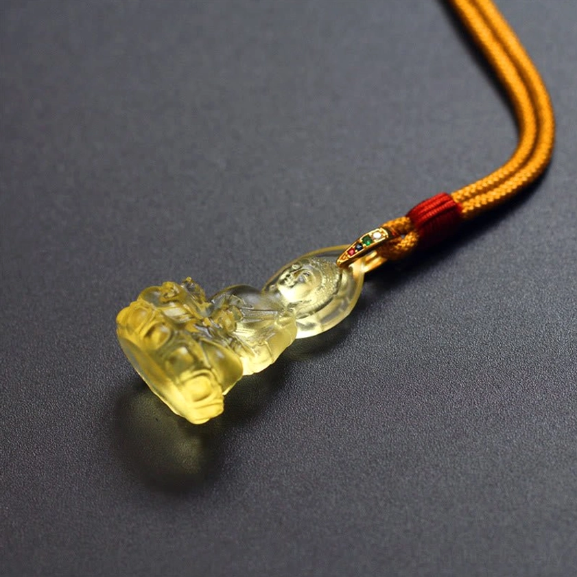 Medicine Buddha necklace full presentation showing cord length adjustment and pendant wearing style