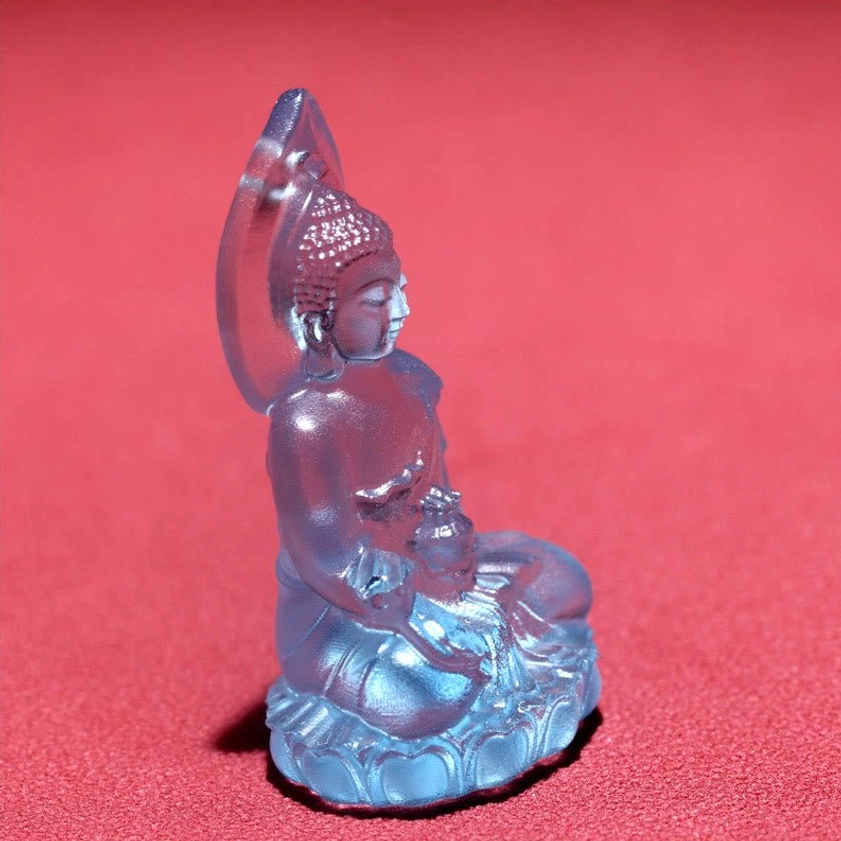 Medicine Buddha Liuli crystal pendant size reference showing 38mm diameter on neutral surface