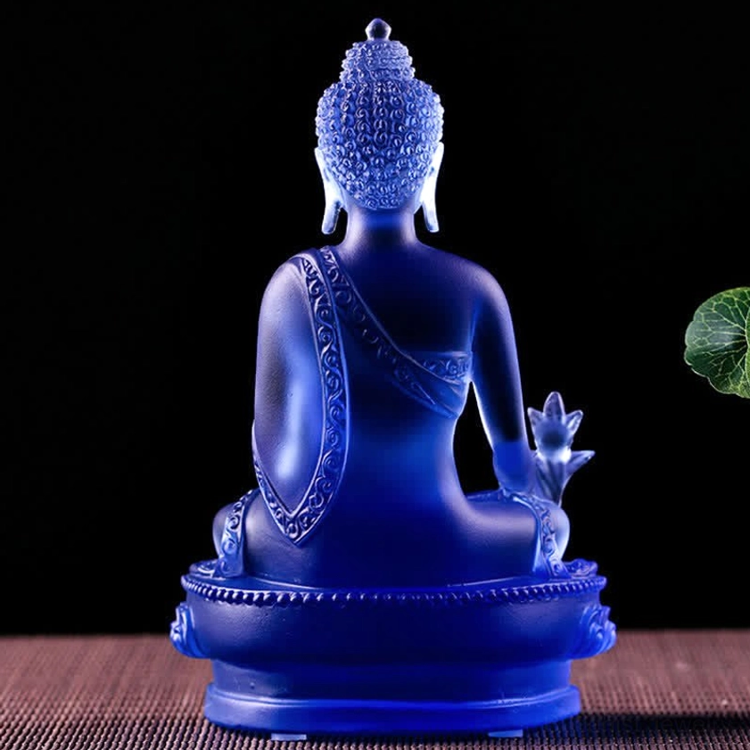 Medicine Buddha Liuli statue rear view showing carved robe details, deep blue glass, lotus base, back angle perspective