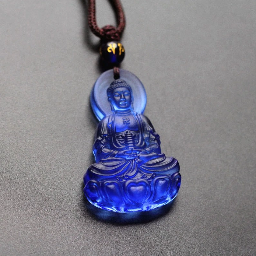 Royal blue glazed Buddhist pendant necklace with seated Buddha and halo in translucent Liuli crystal glass, artisan handcrafted spiritual jewelry