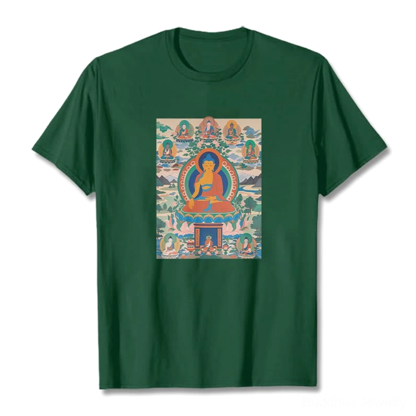Medicine Buddha thangka forest green cotton t-shirt flat lay showing detailed spiritual design