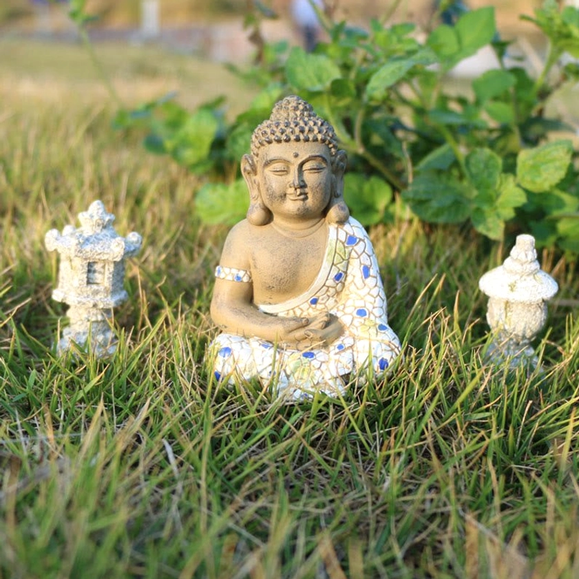Meditating zen Buddha with cross-legged pose and mini stone lanterns, complete altar decoration collection
