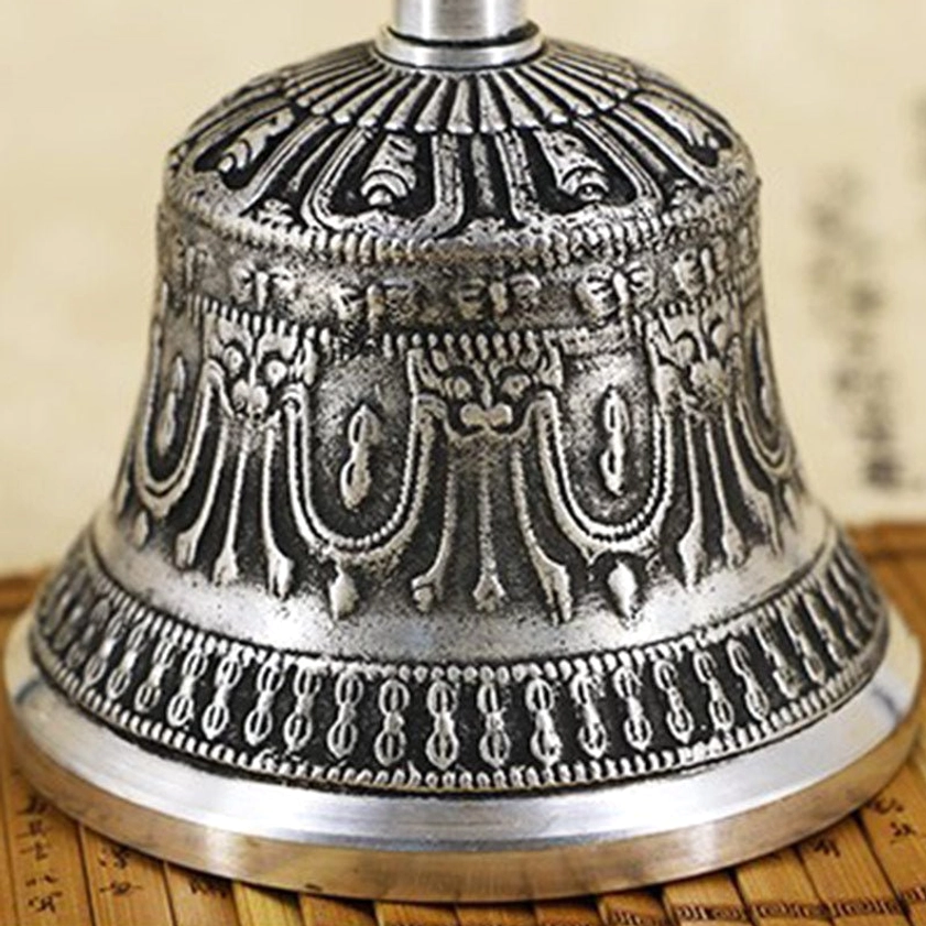 Handmade Buddhist meditation bell showing traditional Nepalese craftsmanship with religious symbols and patterns