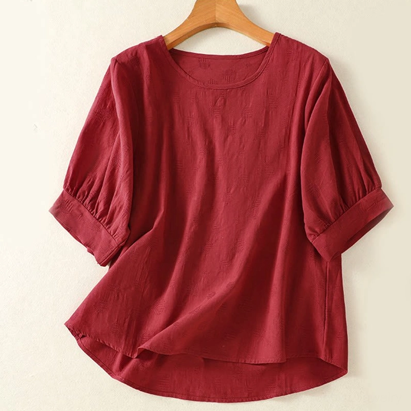 Brown meditation blouse front view on hanger - crew neck yoga top for spiritual practice wear