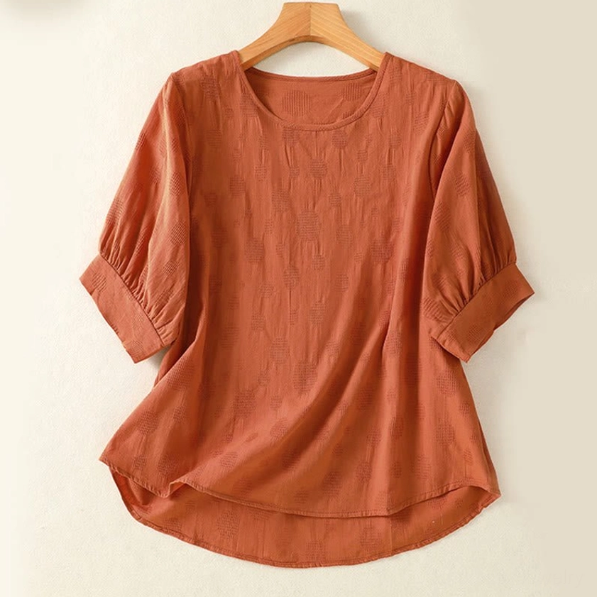 Chocolate brown meditation blouse front view on hanger - crew neck yoga top for spiritual practice