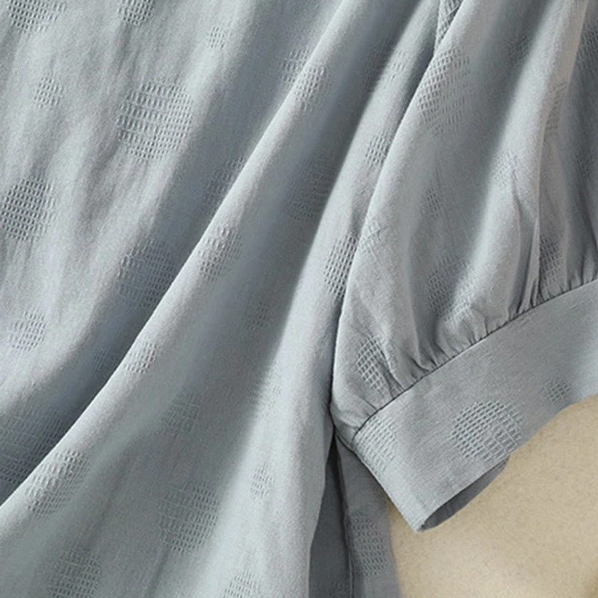 Short sleeve cuff detail of meditation yoga blouse - close-up showing puffed sleeve construction
