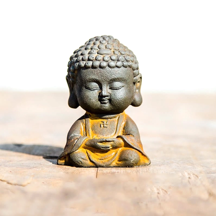 Single meditation Buddha statue in dhyana mudra pose with hands in lap showing serene contemplative expression