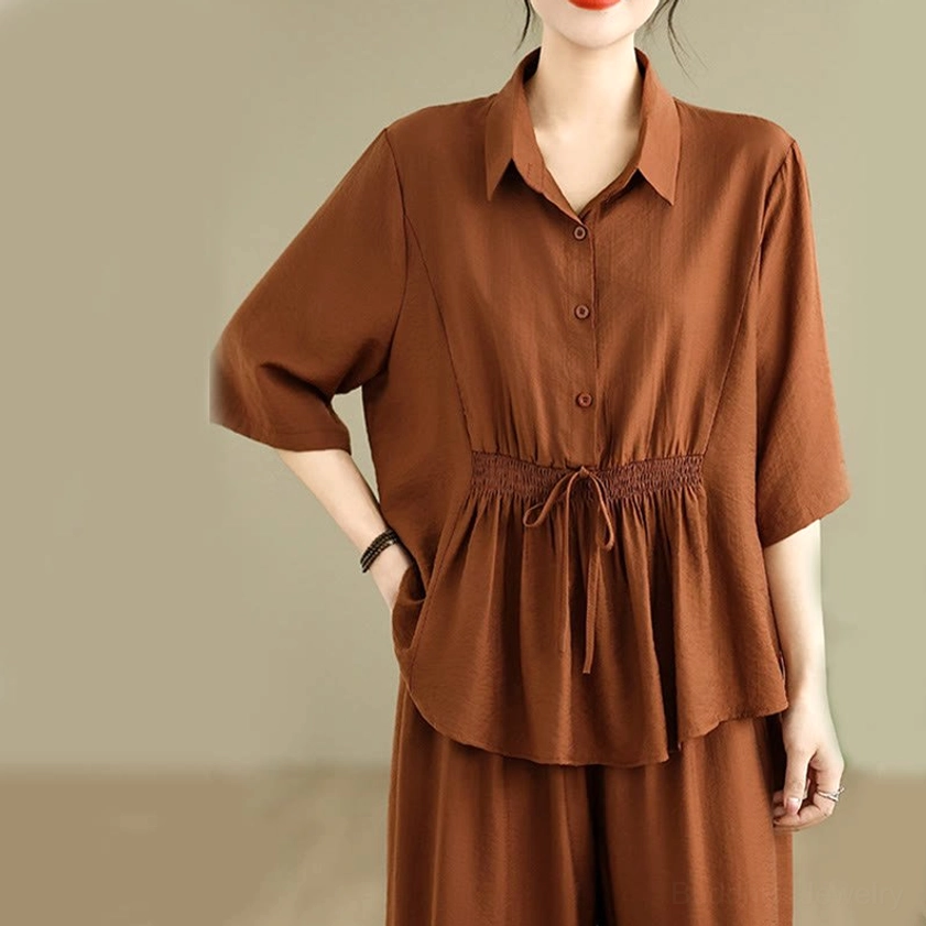 Meditation top close-up - short-sleeve shirt with stand collar, front buttons, and drawstring waist detail
