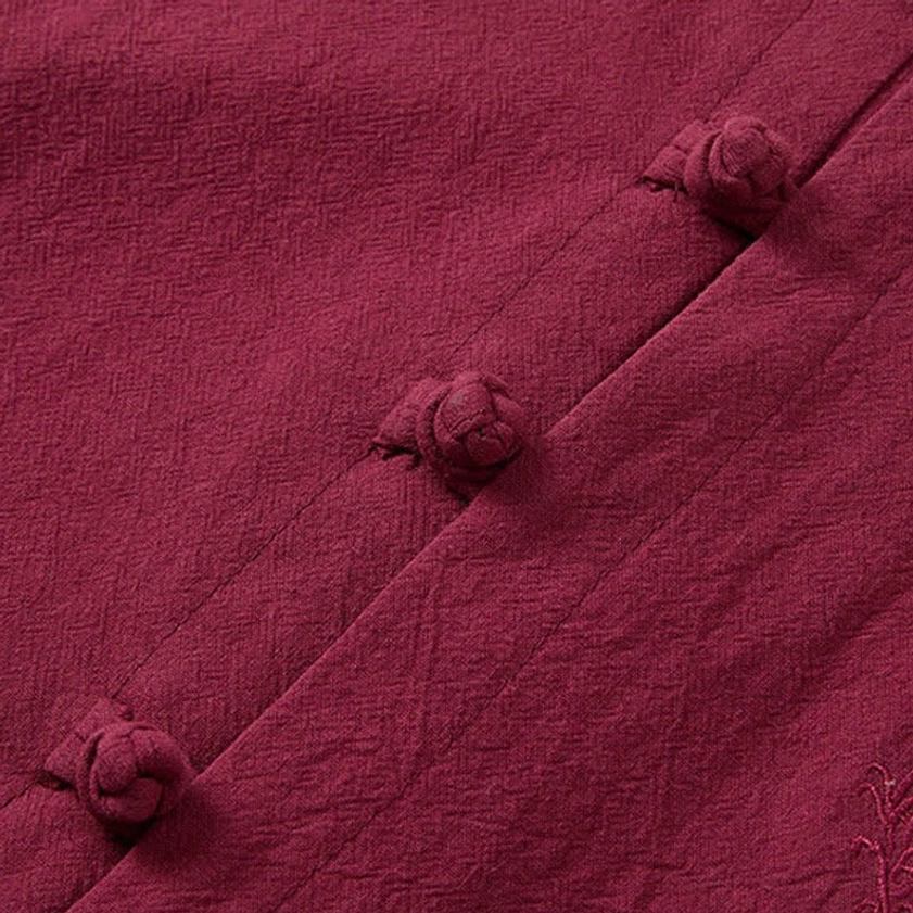 Traditional frog button closure detail on burgundy meditation clothing, authentic Eastern design
