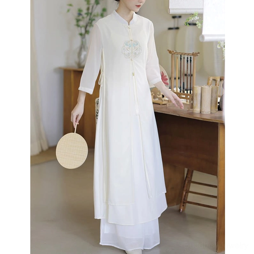 Embroidered meditation dress sleeve detail showcasing three-quarter sheer chiffon sleeves and delicate embroidery work