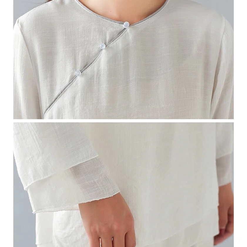 Front detail of white meditation linen top showing crew neckline three-quarter sleeve design for Buddhist yoga practice clothing