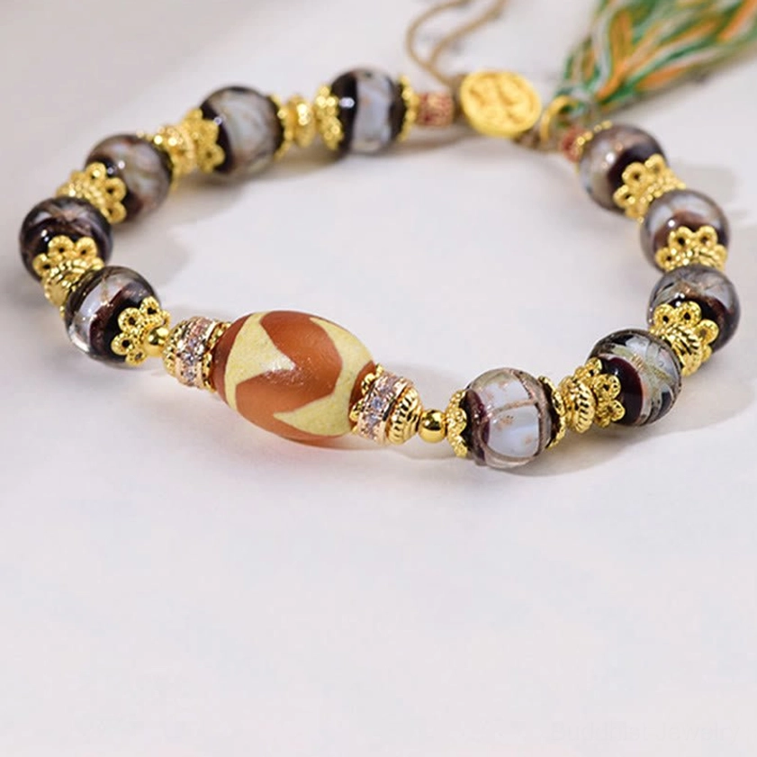 Sacred dzi bead bracelet for meditation and mindfulness practice with natural elastic cord construction