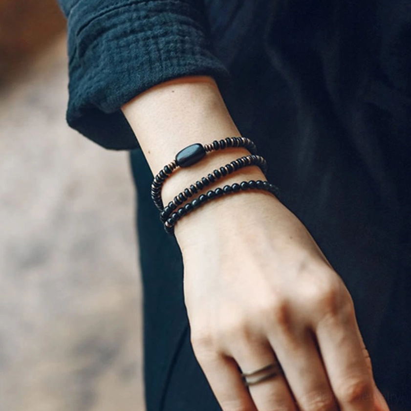Triple wrap rainbow obsidian bracelet for meditation and mindfulness practice, featuring natural healing stone beads