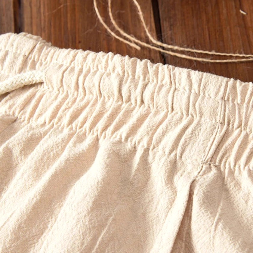 Elasticated waistband with adjustable drawstring on natural beige linen meditation pants for comfortable fit