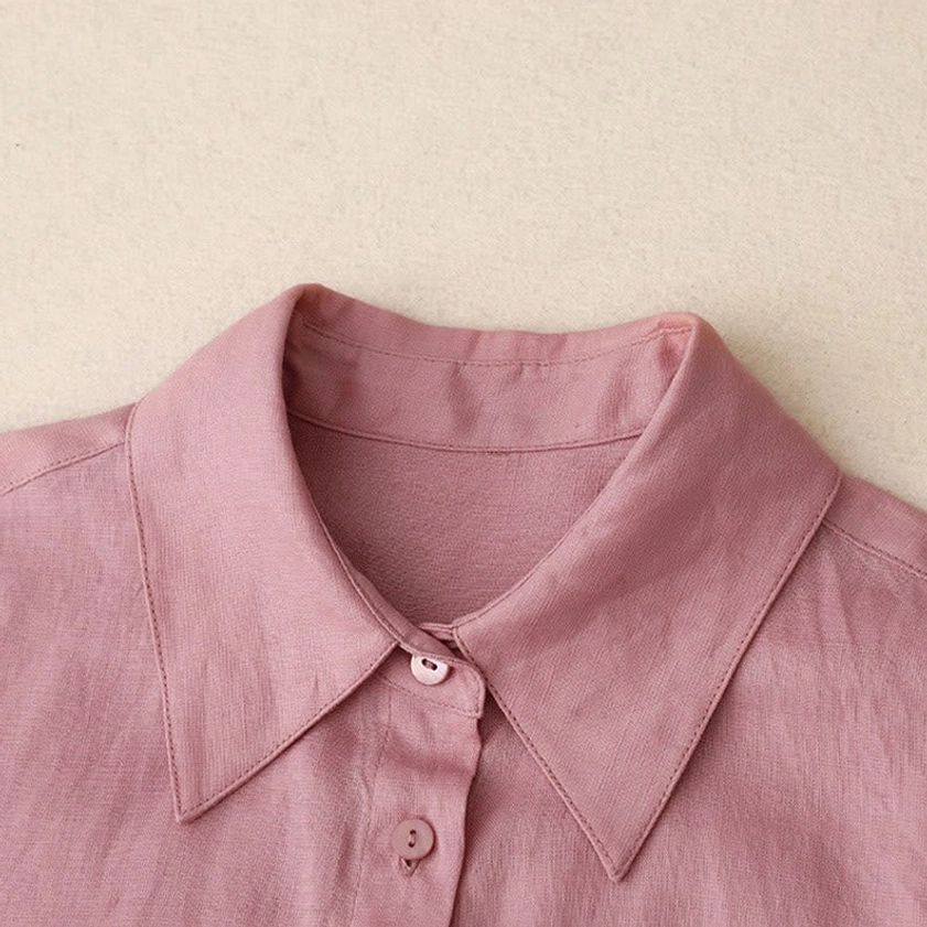 Close-up detail of meditation shirt collar and front placket showing pointed collar and matching buttons