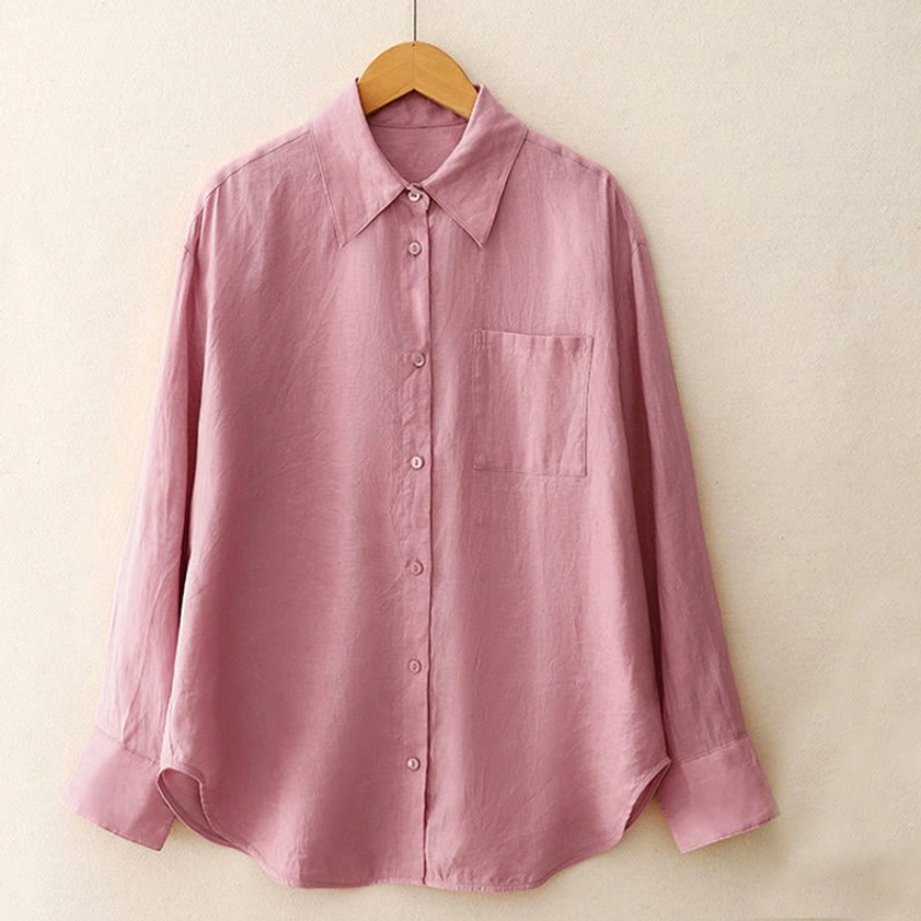 Long-sleeve meditation shirt front flat lay with pointed collar, chest patch pocket, and curved hem