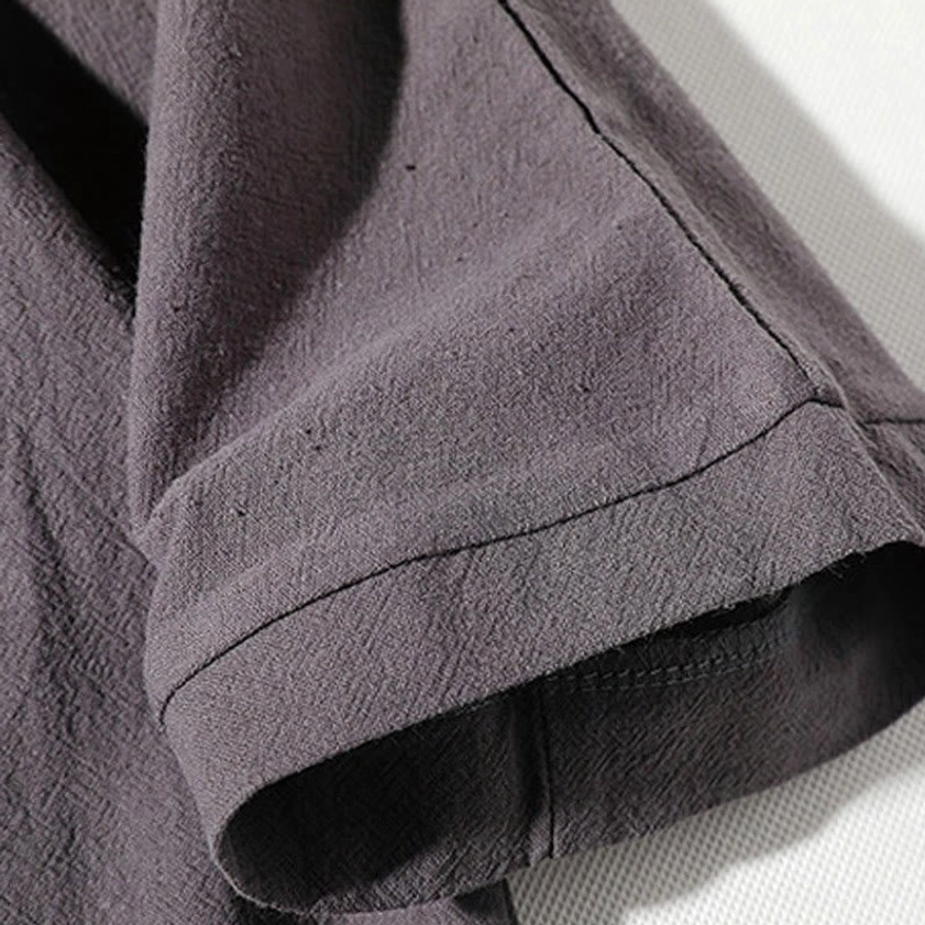 Short sleeve cuff detail - rolled hem and soft fabric texture on meditation linen clothing