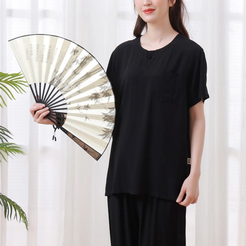 Meditation Tai Chi uniform worn by model demonstrating breathing practice posture