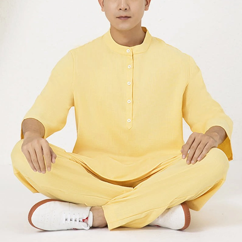 Close-up of meditation clothing fabric quality, cotton linen weave showing breathability and skin-friendly texture
