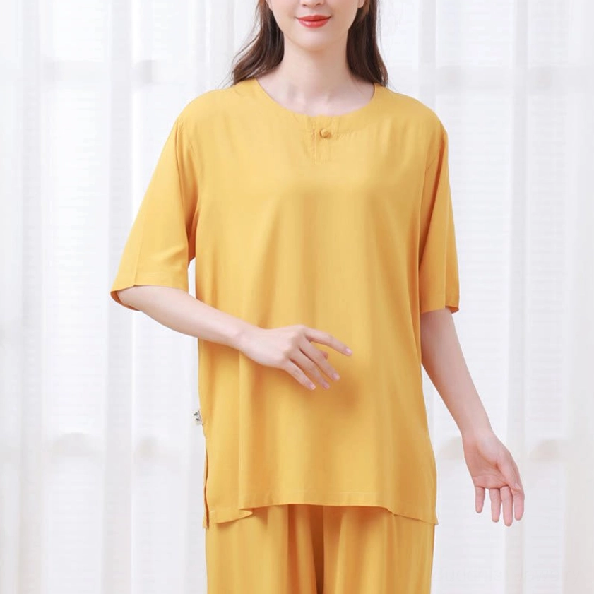 Mustard yellow meditation suit standing front view with side slit detail