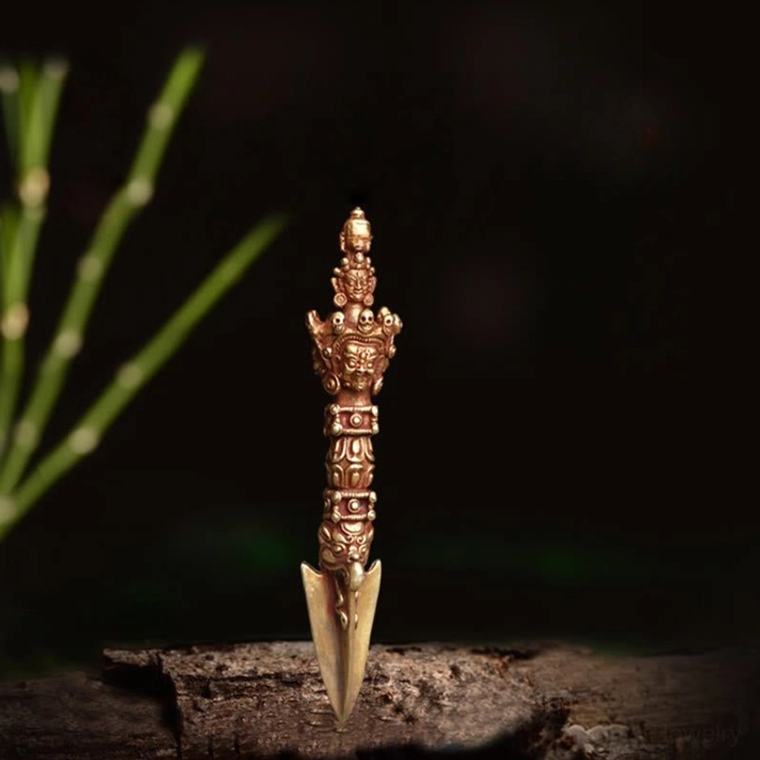 Centered standing view of handcrafted Vajra Dorje against dark background, displaying delicate relief carvings and traditional Nepalese craftsmanship on shaft