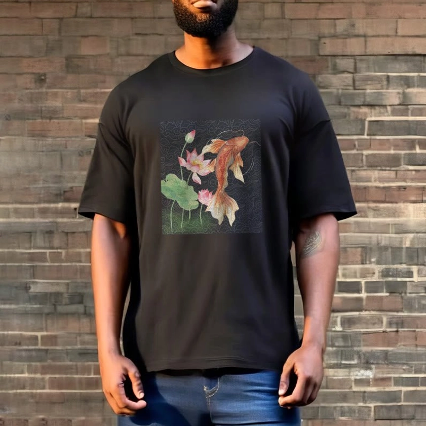 Male model wearing black Buddhist koi fish lotus t-shirt against brick wall casual style