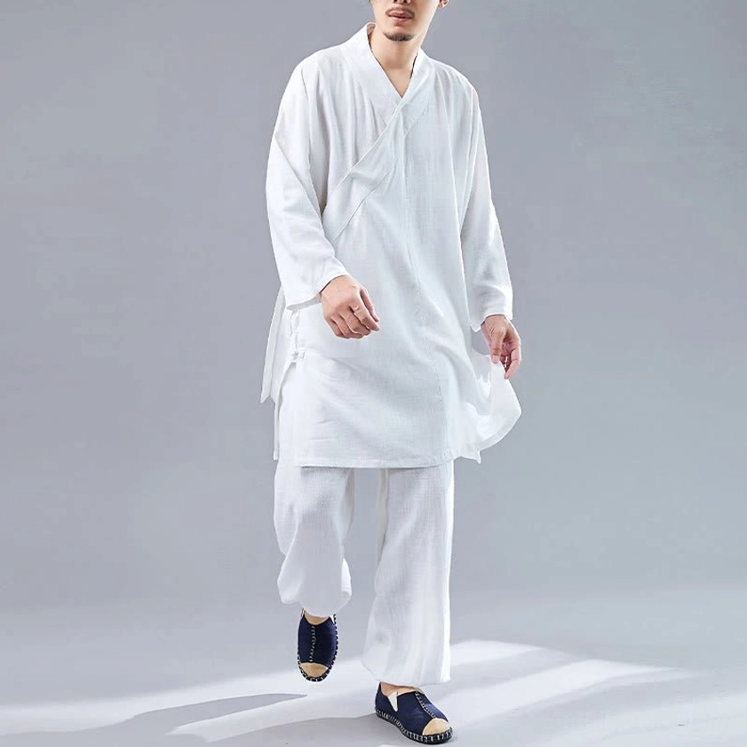 Walking pose in white meditation outfit set showing side detail and comfortable loose silhouette