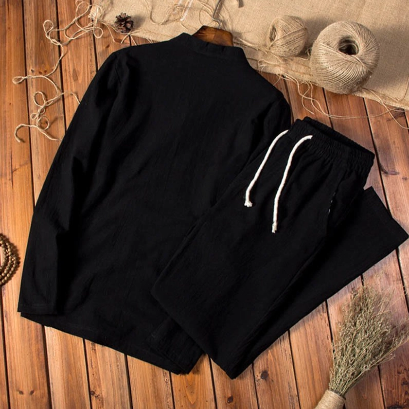 Complete view of black men's linen two-piece meditation set with comfortable pants and henley neckline