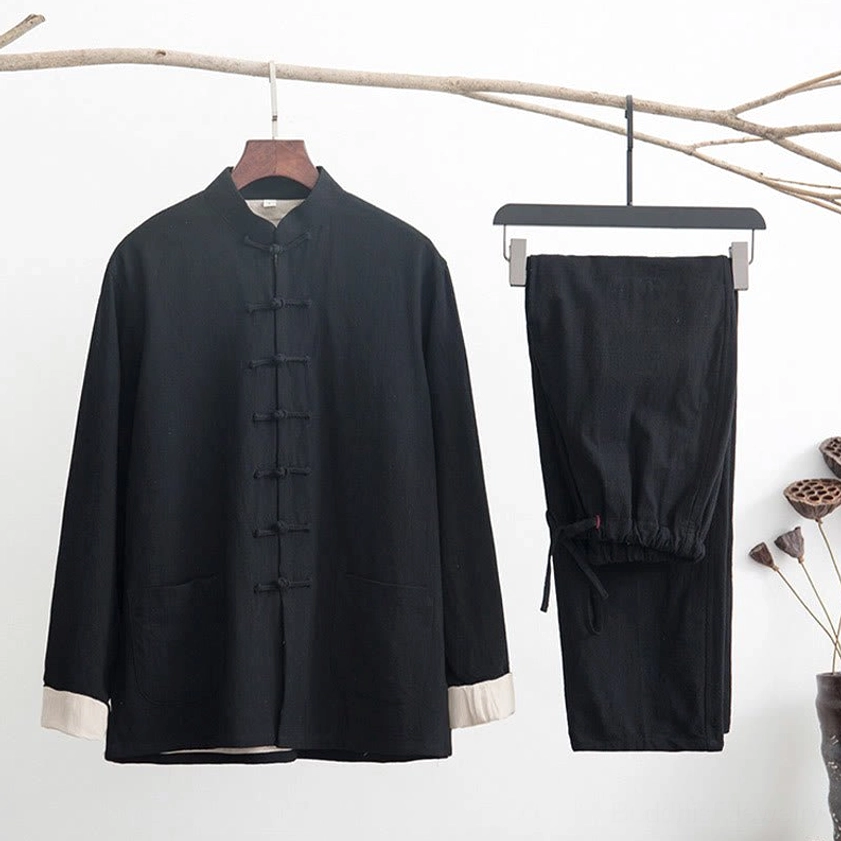 Black linen men's tang suit two-piece set with contrast white cuffs and traditional frog button details in zen style