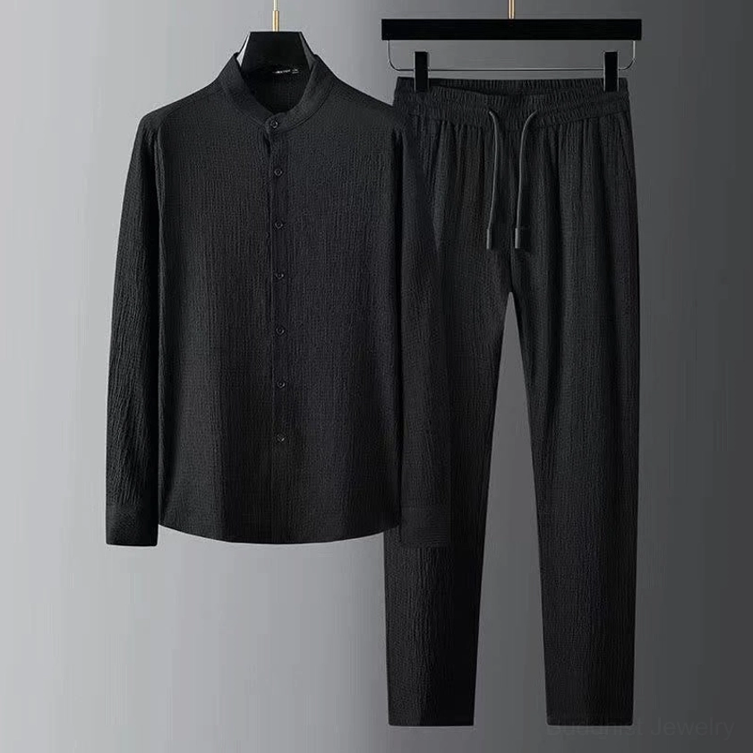 Men's black Buddhist meditation linen shirt and drawstring pants set, front view hanging display