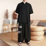 Men's black Buddhist meditation linen suit with frog button collar and wide-leg pants, front full-body view