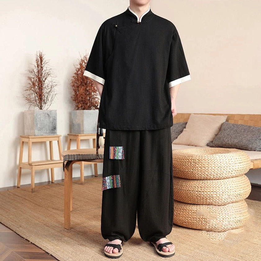 Men's black Buddhist meditation linen suit with frog button collar and wide-leg pants, front full-body view