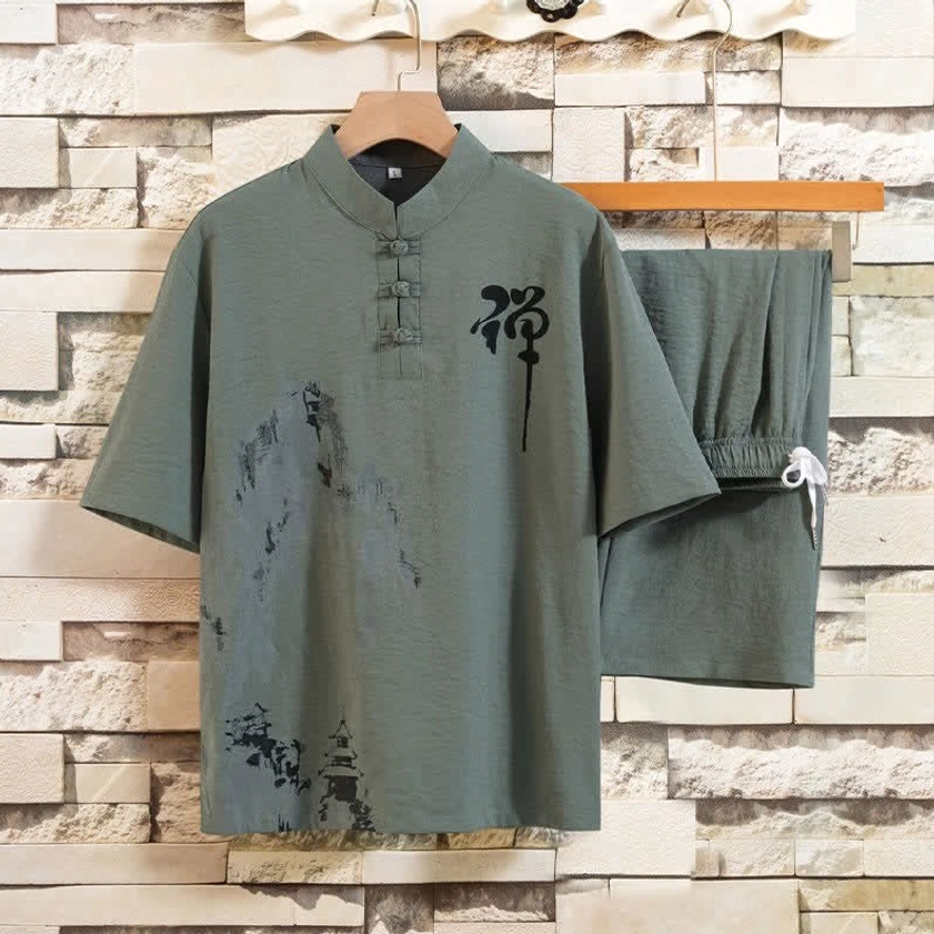 Men's Buddhist meditation two-piece set in sage green colorway with mandarin collar, frog buttons, and traditional Zen ink-wash print