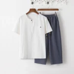 Men's Buddhist meditation cotton linen 2-piece set - white short sleeve shirt and dark gray cropped pants, front flat lay view showing complete outfit with chest pocket details